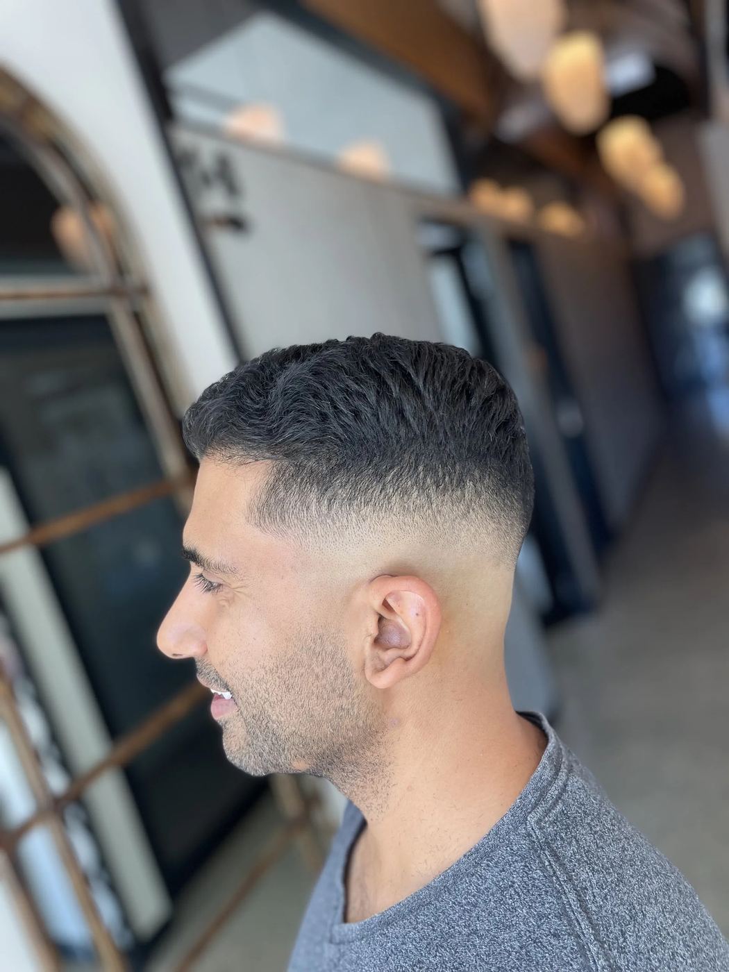 Mid skin fade with natural texture on top